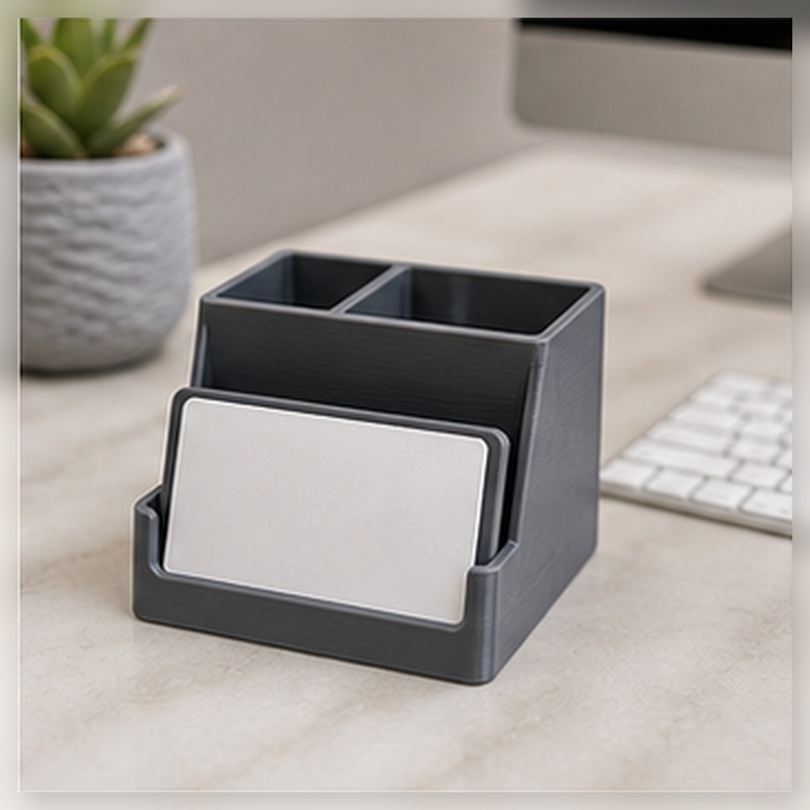 Metal card resting in a desk organizer next to a keyboard